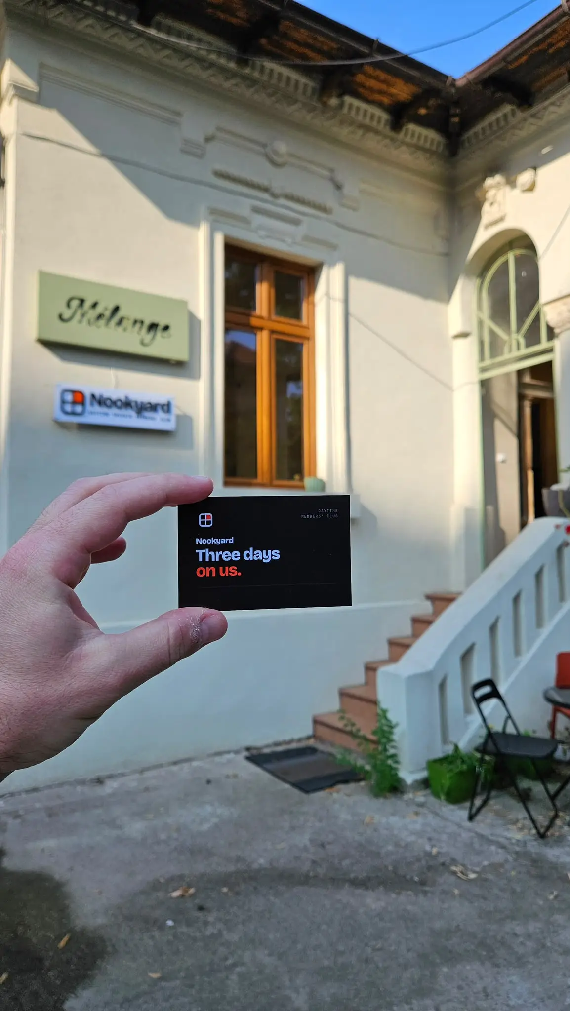 Nookyard Three Days on Us giveaway card, photographed in front of the club entrance